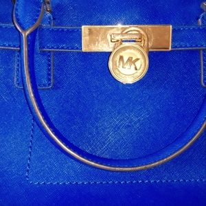 Michael Kors hand bag or purse steel blue with lock and key